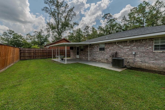 back of property featuring central AC, a patio area, and a lawn