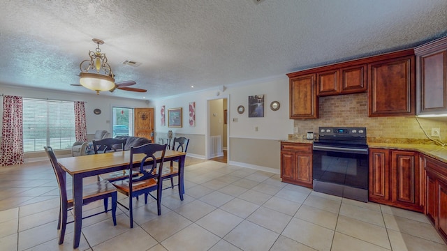 kitchen with light tile patterned floors, black range with electric cooktop, and ceiling fan