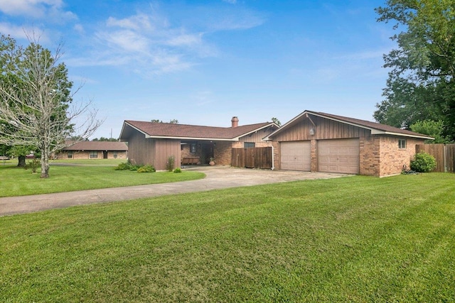 ranch-style house featuring a garage and a front yard