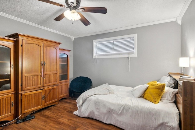 bedroom with a textured ceiling, ceiling fan, crown molding, and dark wood-type flooring