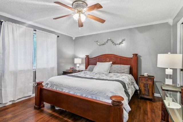 bedroom featuring ceiling fan, dark hardwood / wood-style flooring, a textured ceiling, and ornamental molding