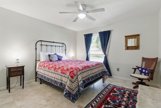 bedroom with baseboards and ceiling fan