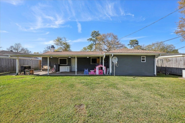 back of property featuring a patio area, a lawn, and fence