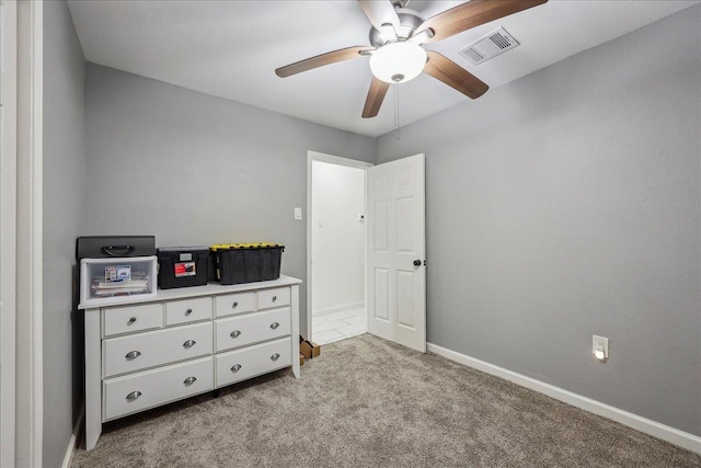 bedroom featuring a ceiling fan, baseboards, visible vents, and light carpet