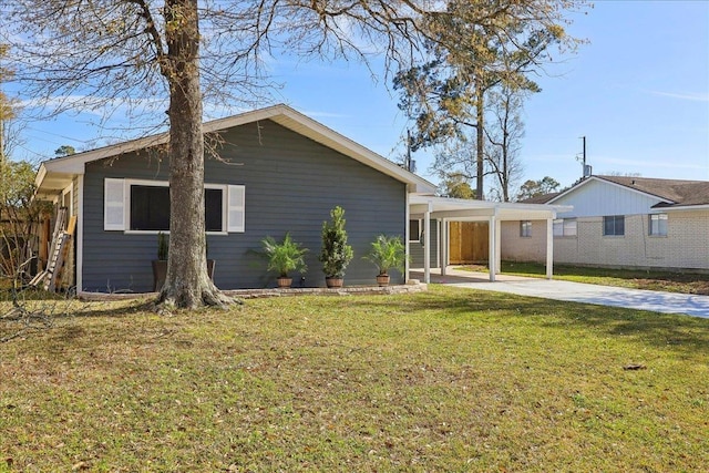 view of front of property with driveway, an attached carport, and a front yard