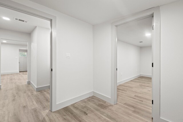 3266 Brent Dr, Orange, TX 77632 - hall featuring light wood-type flooring, baseboards, and recessed lighting