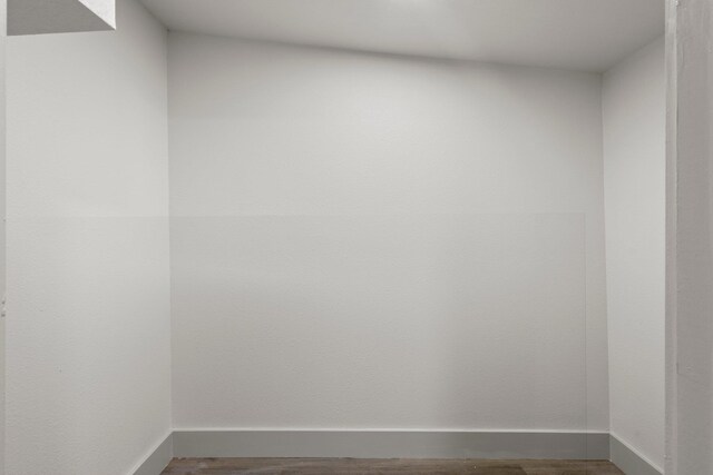 3266 Brent Dr, Orange, TX 77632 - unfurnished room with dark wood-type flooring and baseboards