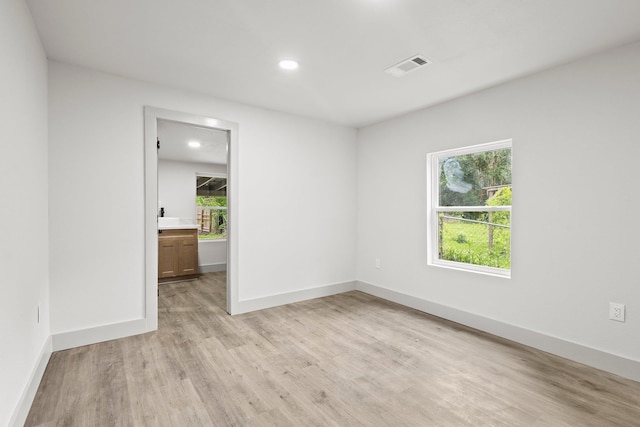 3266 Brent Dr, Orange, TX 77632 - empty room with light wood-style flooring, healthy amount of natural light, recessed lighting, and baseboards