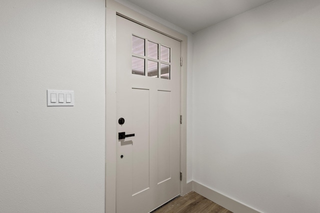 3266 Brent Dr, Orange, TX 77632 - doorway to outside featuring baseboards and dark wood-style floors