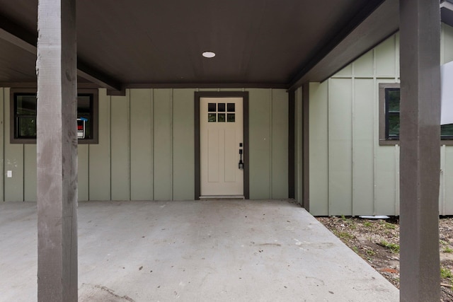 3266 Brent Dr, Orange, TX 77632 - view of exterior entry featuring board and batten siding and a patio area