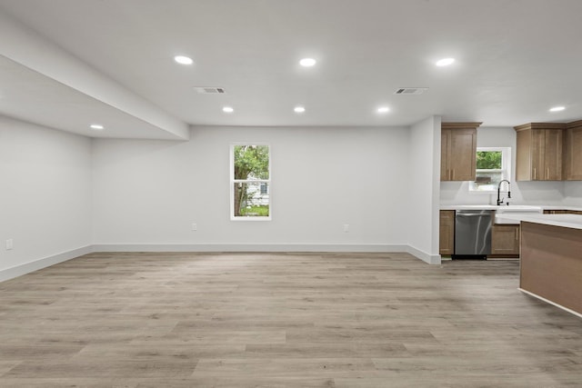3266 Brent Dr, Orange, TX 77632 - kitchen featuring dishwasher, light countertops, recessed lighting, baseboards, and light wood-style floors