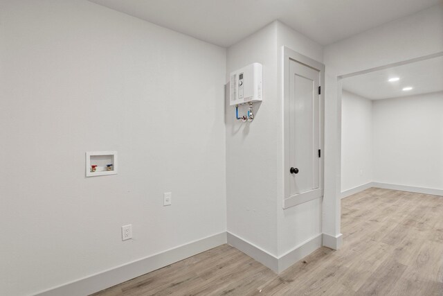 3266 Brent Dr, Orange, TX 77632 - laundry area with hookup for a washing machine, light wood finished floors, and baseboards