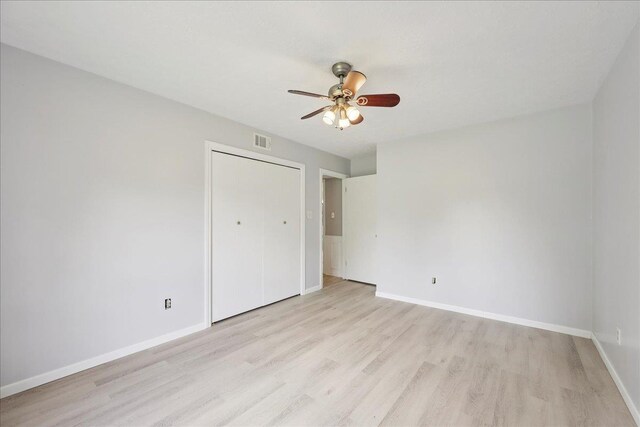 100 Teakwood St, Silsbee, TX 77656 - unfurnished bedroom with light wood-style flooring, a closet, and ceiling fan