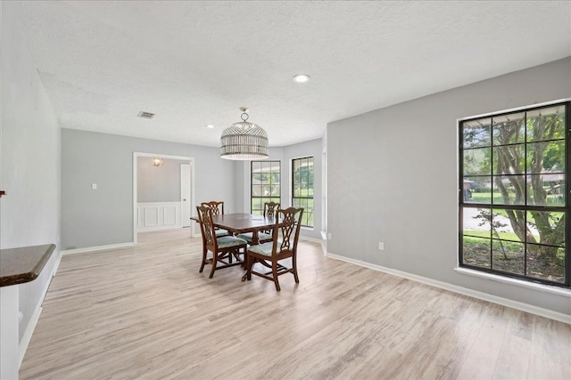 100 Teakwood St, Silsbee, TX 77656 - dining space with a textured ceiling, light wood-style flooring, and recessed lighting