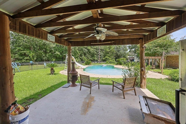 100 Teakwood St, Silsbee, TX 77656 - fenced backyard with ceiling fan and a patio