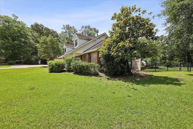 100 Teakwood St, Silsbee, TX 77656 - view of home's exterior with brick siding