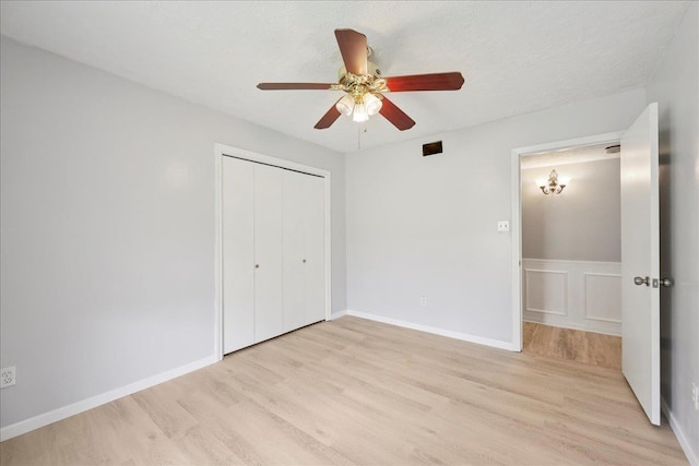 100 Teakwood St, Silsbee, TX 77656 - unfurnished bedroom with light wood-style floors, a closet, and ceiling fan