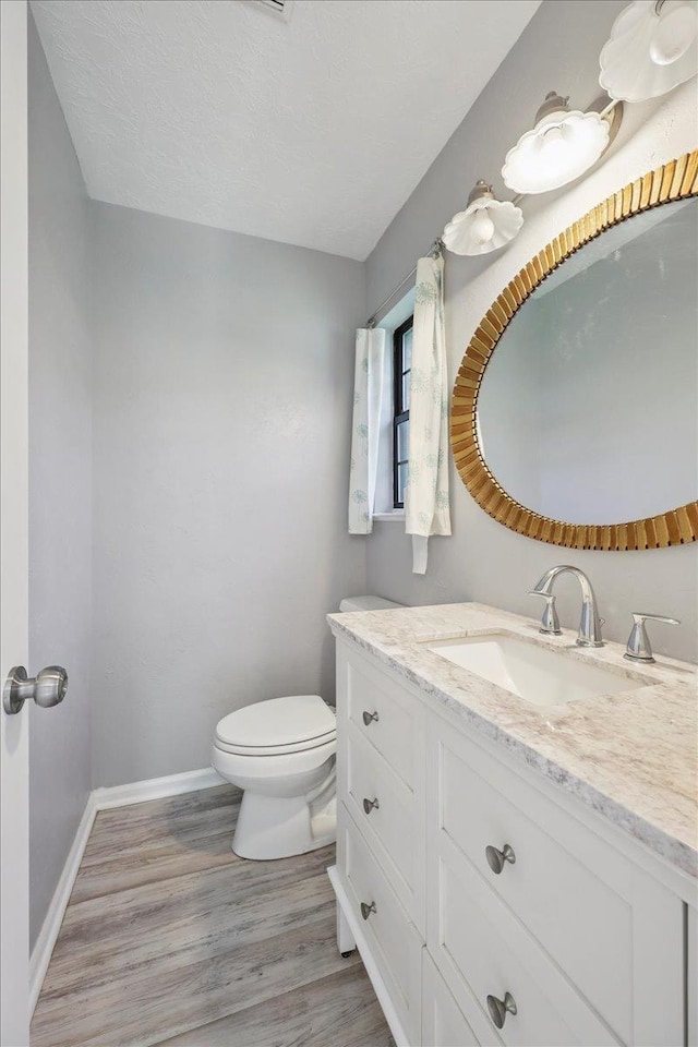 100 Teakwood St, Silsbee, TX 77656 - bathroom with vanity and wood finished floors