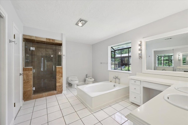 100 Teakwood St, Silsbee, TX 77656 - bathroom with tile patterned flooring, double vanity, a stall shower, a bath, and a bidet