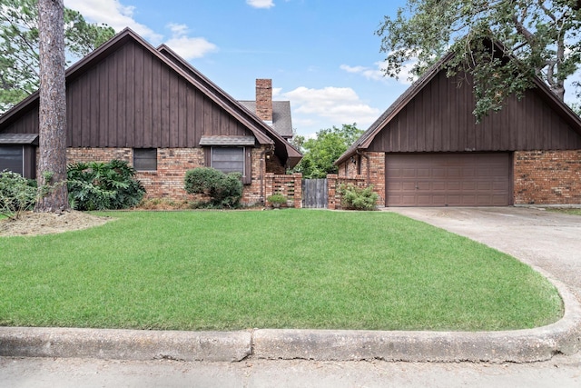 view of front facade featuring a garage, brick siding, a chimney, and a front lawn