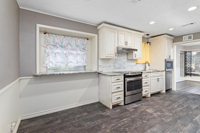 kitchen with visible vents, dark wood finished floors, stainless steel appliances, under cabinet range hood, and backsplash