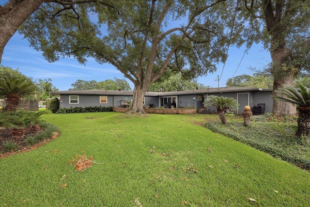 5775 Clinton St, Beaumont, TX 77706 - view of front of home with a front lawn