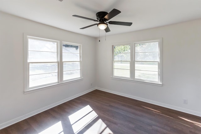 spare room featuring ceiling fan and dark hardwood / wood-style floors