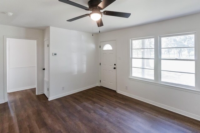 foyer entrance with ceiling fan and dark hardwood / wood-style floors