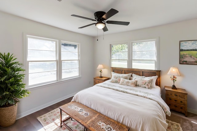 bedroom featuring ceiling fan and dark wood-type flooring