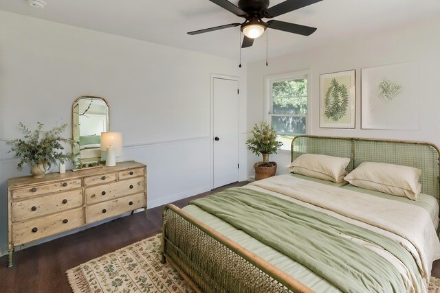 bedroom featuring ceiling fan and dark hardwood / wood-style floors