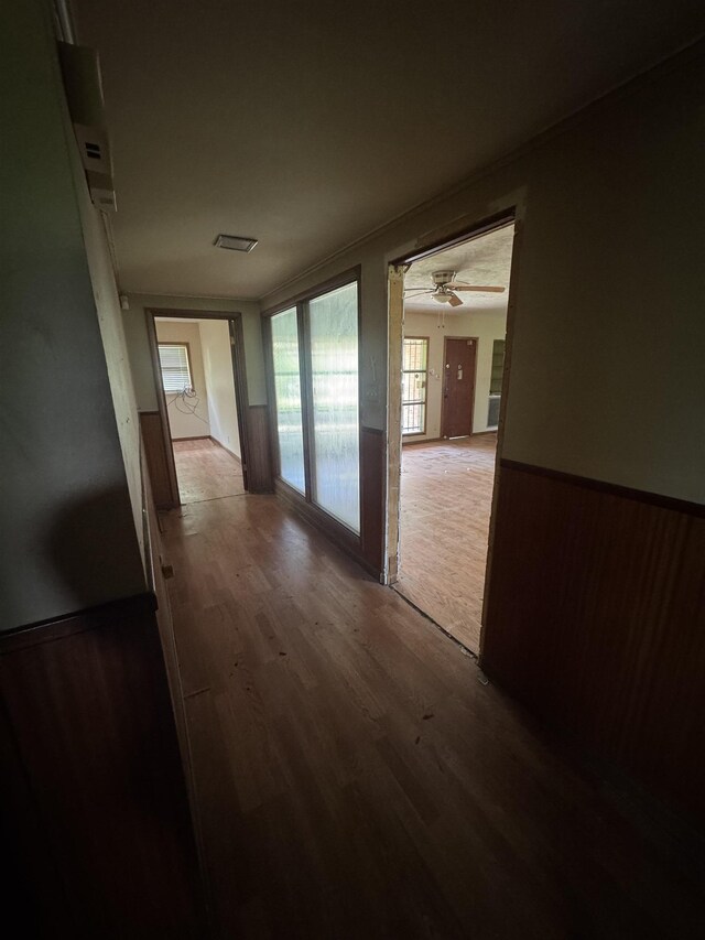 2595 Beech St, Beaumont, TX 77702 - corridor featuring wood finished floors and wainscoting