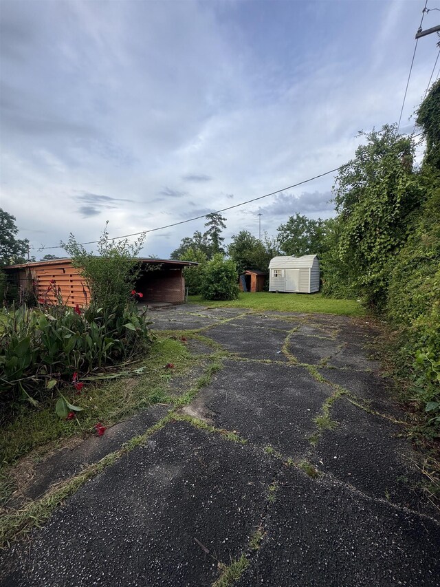 2595 Beech St, Beaumont, TX 77702 - view of yard with a shed