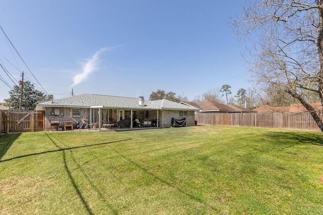 view of yard with a patio area and a fenced backyard