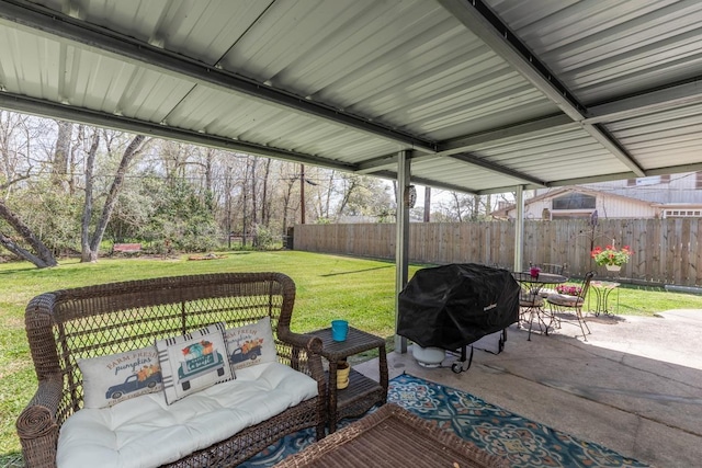 view of patio with a grill and fence