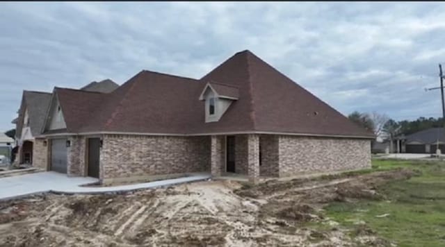 view of property exterior featuring a garage