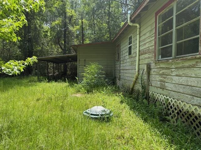 1700 Woodrow St, Silsbee, TX 77656 - view of yard featuring a carport