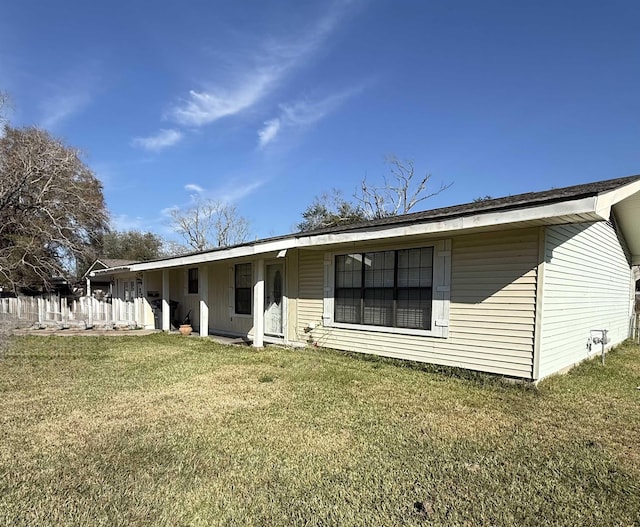 ranch-style house with a front lawn