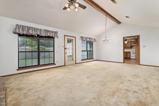 spare room featuring a ceiling fan, plenty of natural light, a chandelier, and carpet flooring