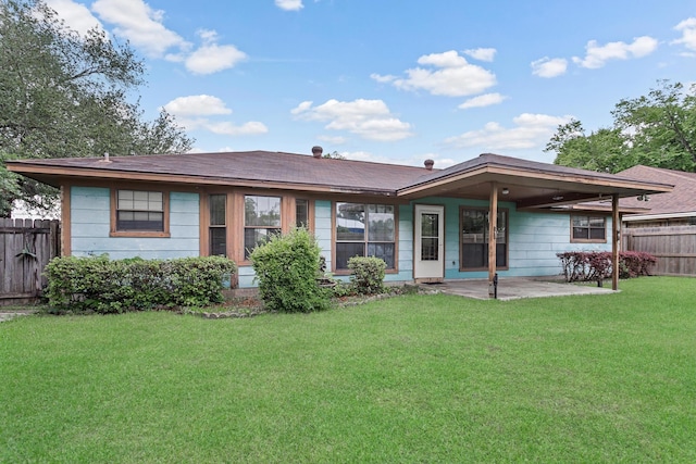 rear view of house with a patio