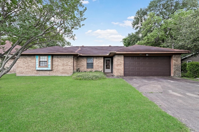 ranch-style house featuring brick siding, a garage, asphalt driveway, and a front lawn