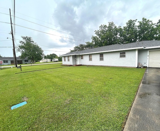 205 Turner Ln, Bridge City, TX 77611 - view of front of property with a front yard and a garage