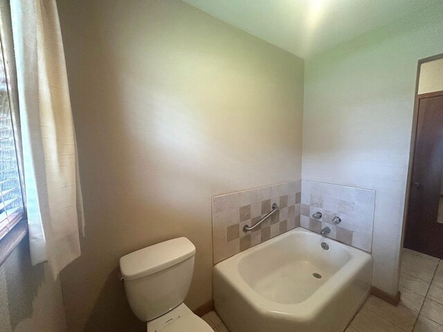 205 Turner Ln, Bridge City, TX 77611 - full bathroom featuring a garden tub and tile patterned flooring