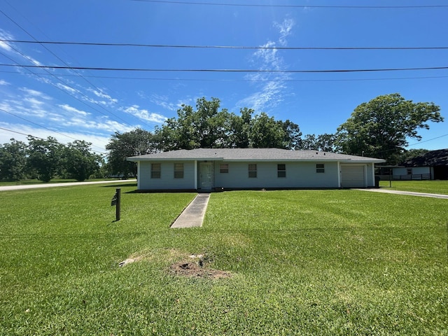 205 Turner Ln, Bridge City, TX 77611 - ranch-style home with a front lawn, driveway, and a garage