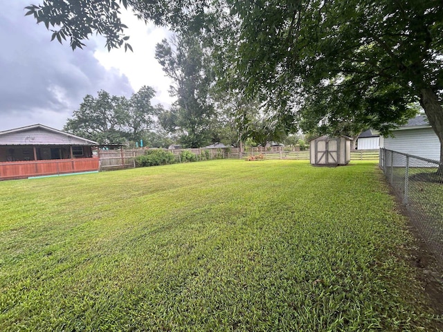 205 Turner Ln, Bridge City, TX 77611 - fenced backyard with a storage unit and a sunroom