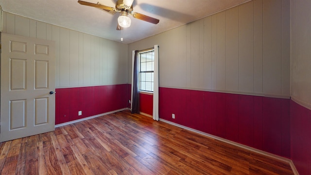 spare room featuring ceiling fan and hardwood / wood-style floors