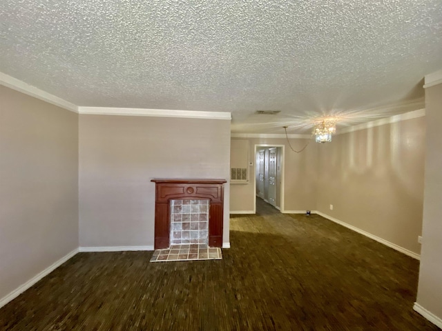 unfurnished living room featuring crown molding, a tiled fireplace, dark wood-type flooring, a textured ceiling, and a chandelier