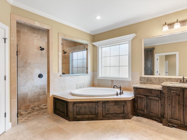 bathroom featuring crown molding, vanity, and independent shower and bath