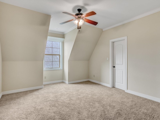 additional living space featuring ceiling fan, light colored carpet, and vaulted ceiling