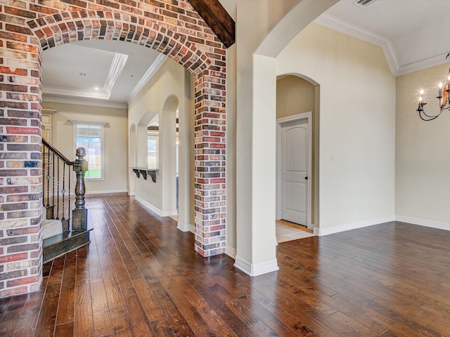 foyer featuring crown molding and dark hardwood / wood-style flooring