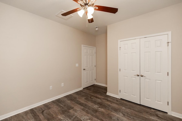 9205 Shepherd Dr, Beaumont, TX 77707 - unfurnished bedroom with baseboards, dark wood-type flooring, a closet, and a ceiling fan